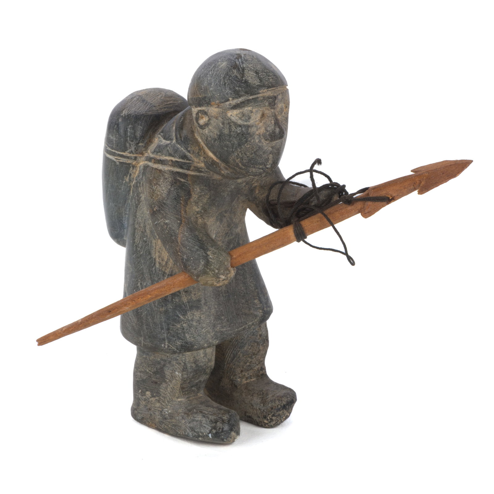 JOE TALIRUNILI, INUIT, Hunter, Stooped Beneath his Load and Carrying a Spear, c. 1970: JOE TALIRUNILI (1893-1976) PUVIRNITUQ (POVUNGNITUK) Hunter, Stooped Beneath his Load and Carrying a Spear, c. 1970 stone, wood, and string, 3.75 x 3.75 x 3 (9.5 x 9.5 x 7.6 cm), measurements reflect d