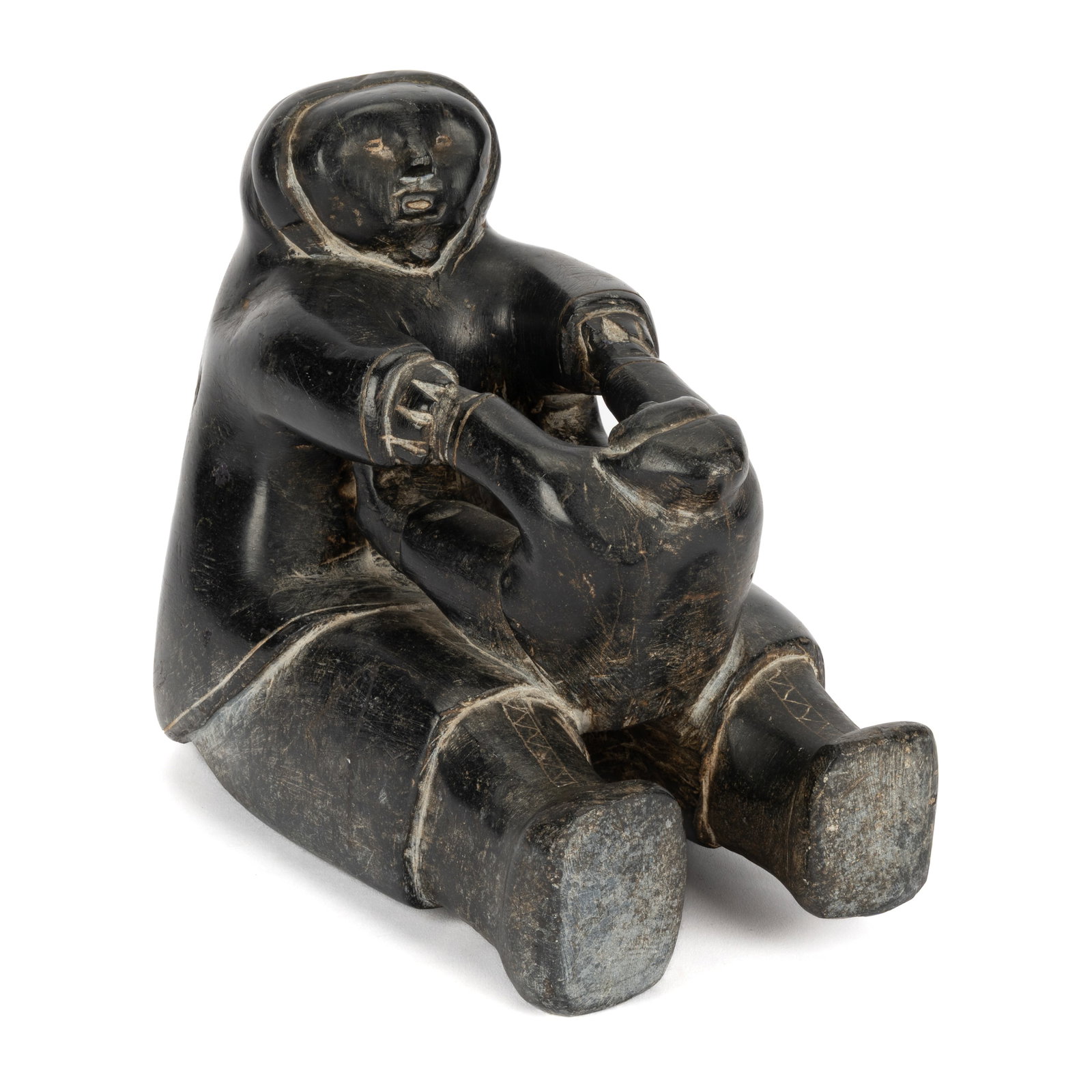 UNIDENTIFIED INUIT ARTIST, NUNAVIK (ARCTIC QUEBEC), Seated Father, Playing with Child, c. 1960s: UNIDENTIFIED INUIT ARTIST, NUNAVIK (ARCTIC QUEBEC) Seated Father, Playing with Child, c. 1960s stone, 7.5 x 9 x 5.5 in (19.1 x 22.9 x 14 cm) unsigned. Provenance An American Private Collection. While 