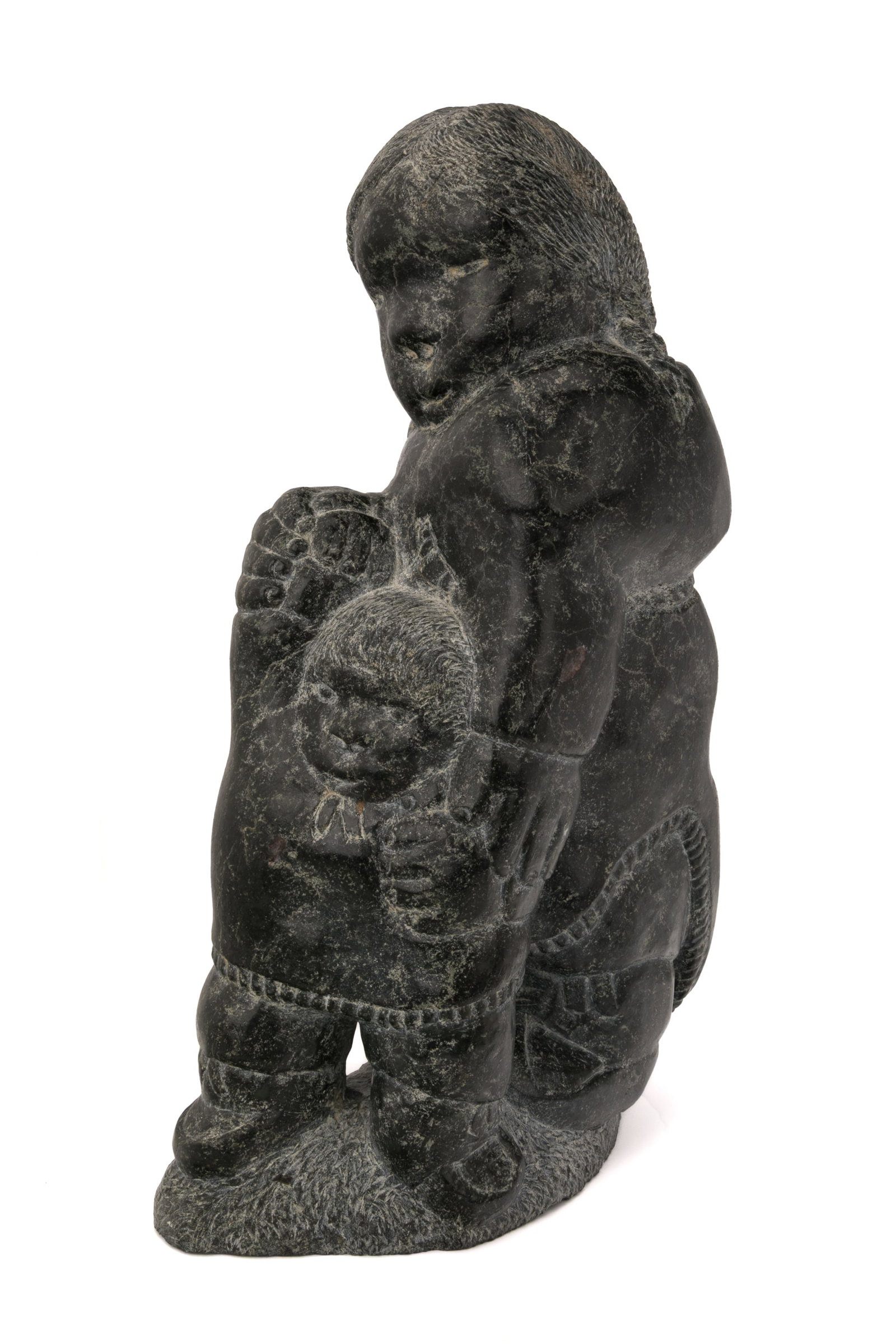 JOHNNY INUKPUK, INUIT, Mother Teaching Young Child to walk, late 1970s / early 1980s: JOHNNY INUKPUK, R.C.A. (1911-2007) INUKJUAK (PORT HARRISON) Mother Teaching Young Child to walk, late 1970s / early 1980s stone, 15.25 x 9.5 x 5.5 in (38.7 x 24.1 x 14 cm) unsigned. Provenance Collect