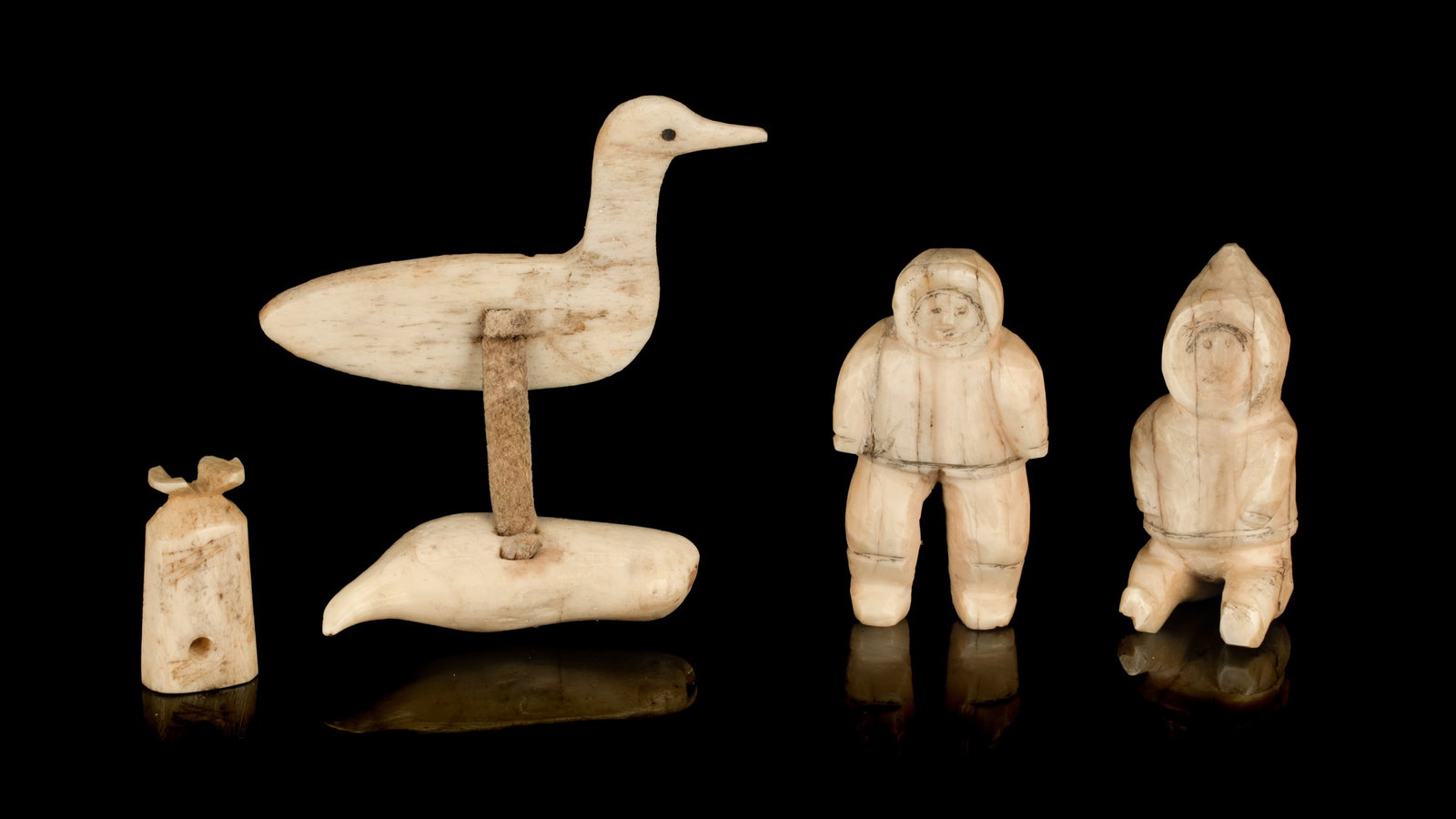 UNIDENTIFIED INUIT ARTIST(S), Group Lot of Lure, Harpoon Line Toggle, and Two Figures, mid-20th: UNIDENTIFIED INUIT ARTIST(S) Group Lot of Lure, Harpoon Line Toggle, and Two Figures, mid-20th Century see firstarts.ca for details, the largest (the lure), 2 x 2 x 0.5 in (5.1 x 5.1 x 1.3 cm) and sma