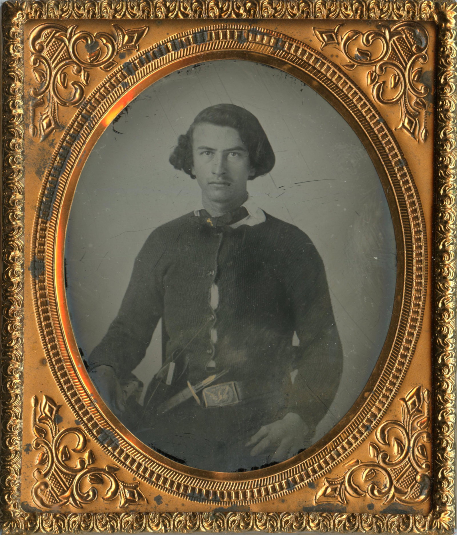 Gallant Ambrotype- Perhaps Confederate or Partisan: Gallant Ambrotype- Perhaps Confederate or Partisan Civil War era sixth plate ambrotype depicting a gallant young soldier wearing a determined expression. A knife and holstered pistol are worn on his b