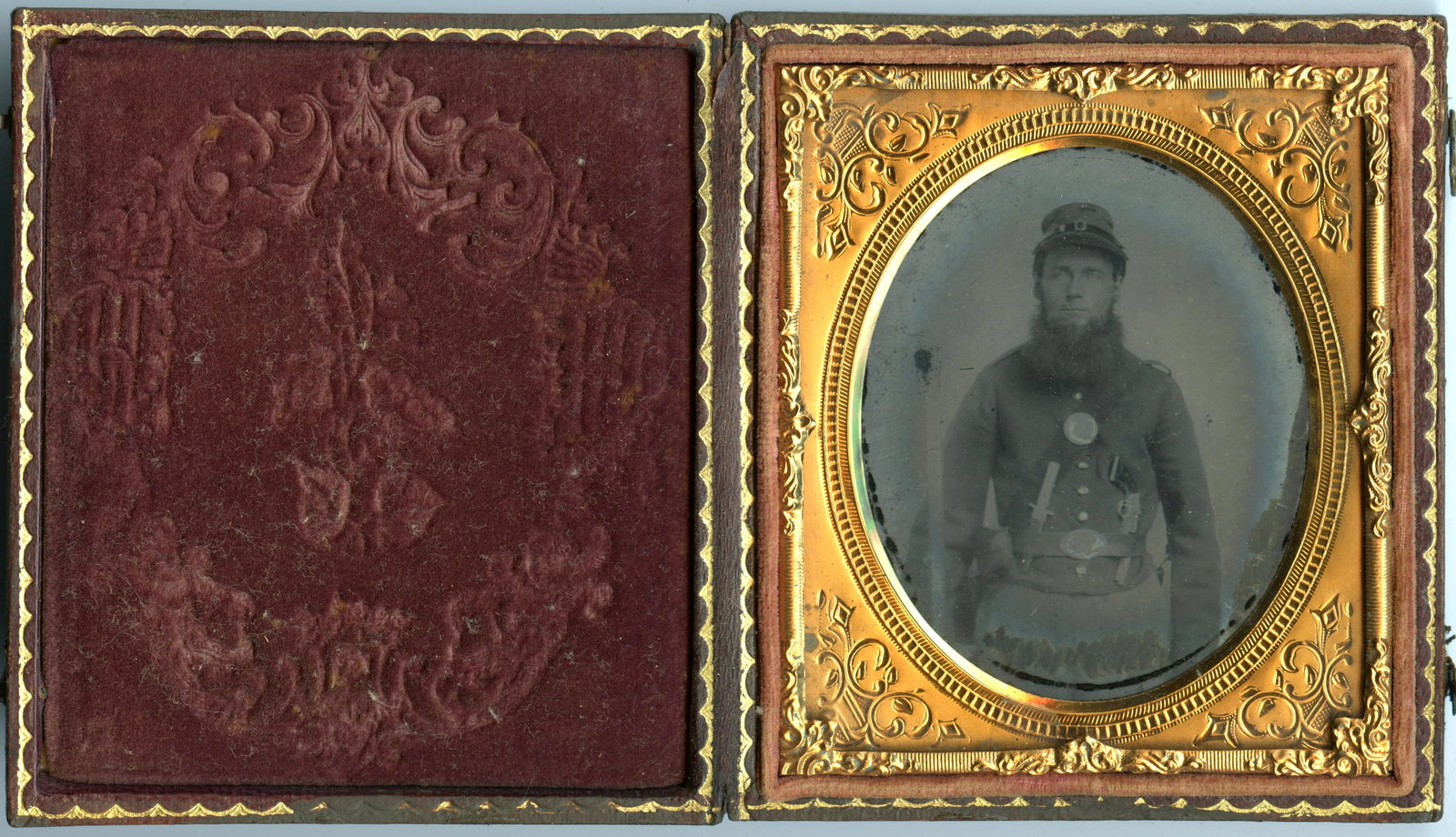 Triple-Armed Civil War Soldier Ambrotype: Triple-Armed Civil War Soldier Ambrotype Sixth plate ambrotype of a Civil War triple-armed soldier equipped with a knife, pistol, and rifle. His jacket bears similarity to state-issued variations used