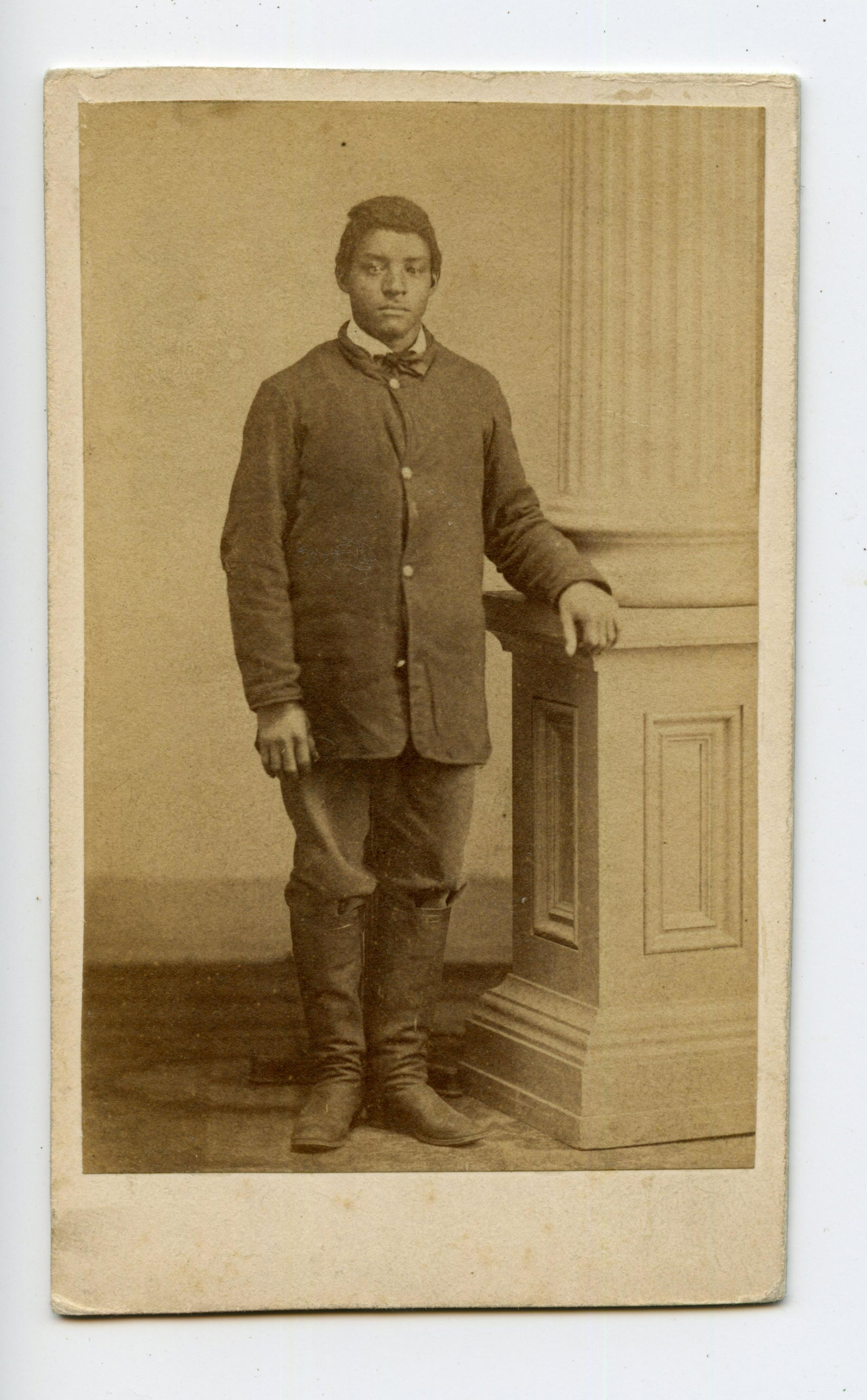 Civil War CDV of African-American Soldier: Civil War CDV of African-American Soldier Excellent Civil War carte-de-visite of an African-American soldier wearing a federally issued sack coat and riding boots. No imprint on reverse. [Black Americ