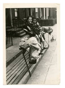 Photo of Children Twirling on a Fence [Chicago]: Lovely Photo (1950s) of a group of children twirling upside down on a fence. Found in Chicago, Illinois. [Snapshot] [Contemporary Photography]