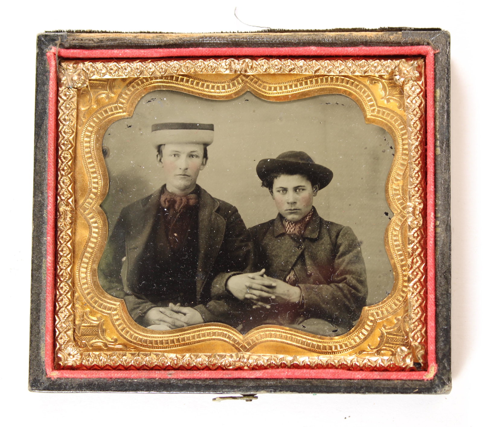 Two Young Men in Interesting Hats [Tintype]: Sixth plate tintype. Housed in a half leatherette case. [Cabinet Card, Albumen, Daguerreotype, CDV, carte-de-visite, Tintype, Ambrotype]