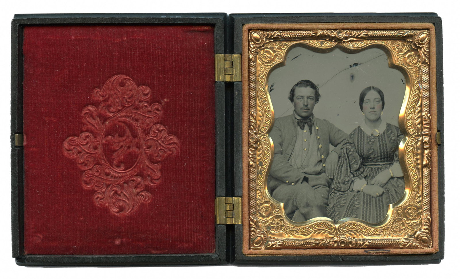 Confederate Cavalryman & Wife [Ambrotype]: Sixth plate ambrotype of William H.H. Crim of the 18th Virginia Cavalry and (presumably) his wife or loved one. Pvt. Crim sits comfortably with his gray, jean-cloth jacket open and legs crossed. Thoug