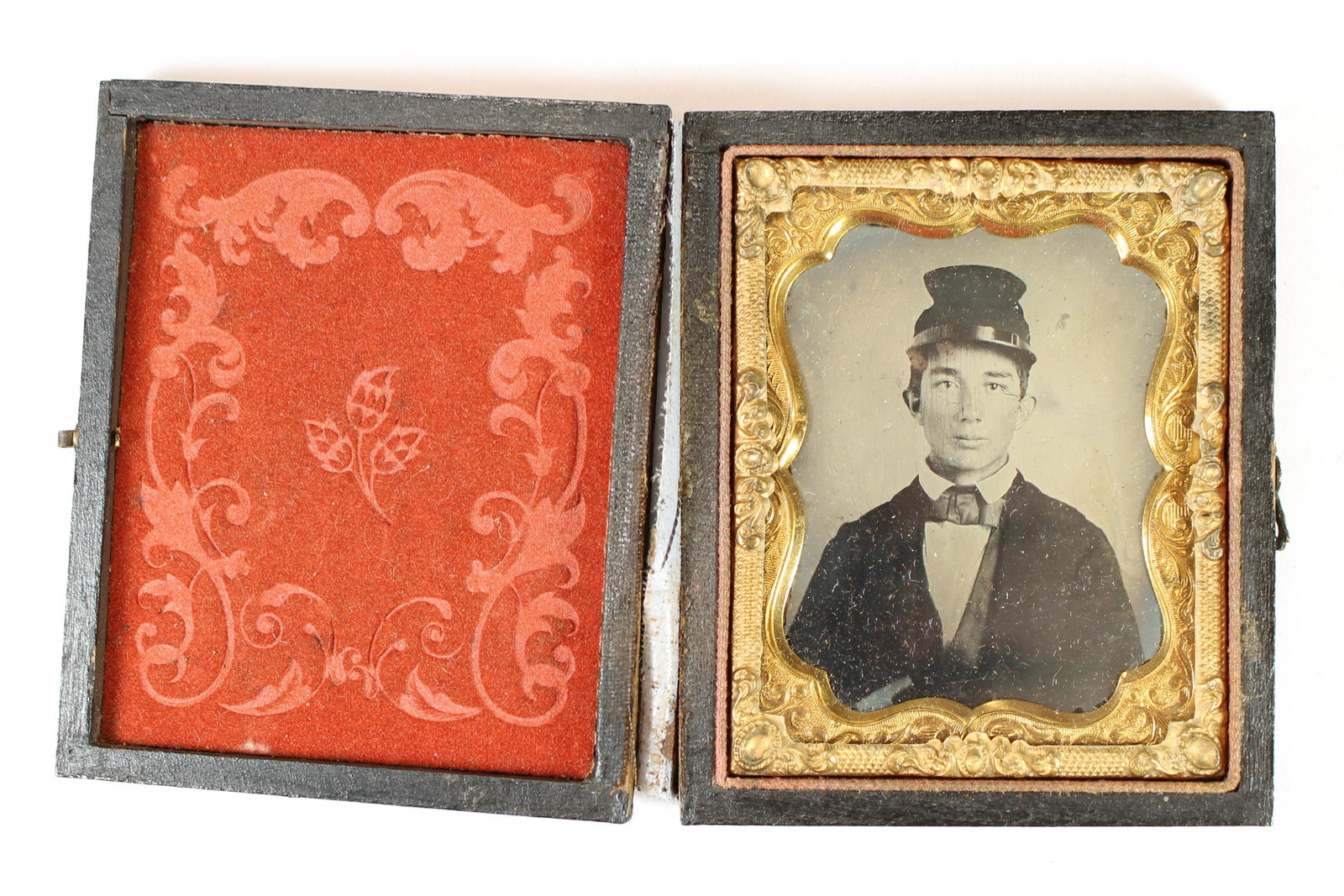 Soldier in Kepi [Ambrotype]: Ninth plate tintype of a Civil War soldier housed in a full leatherette case. [Civil War, Union, Confederate, Daguerreotype, carte-de-visite, CDV, ambrotype, tintype, Robert E. Lee,]
