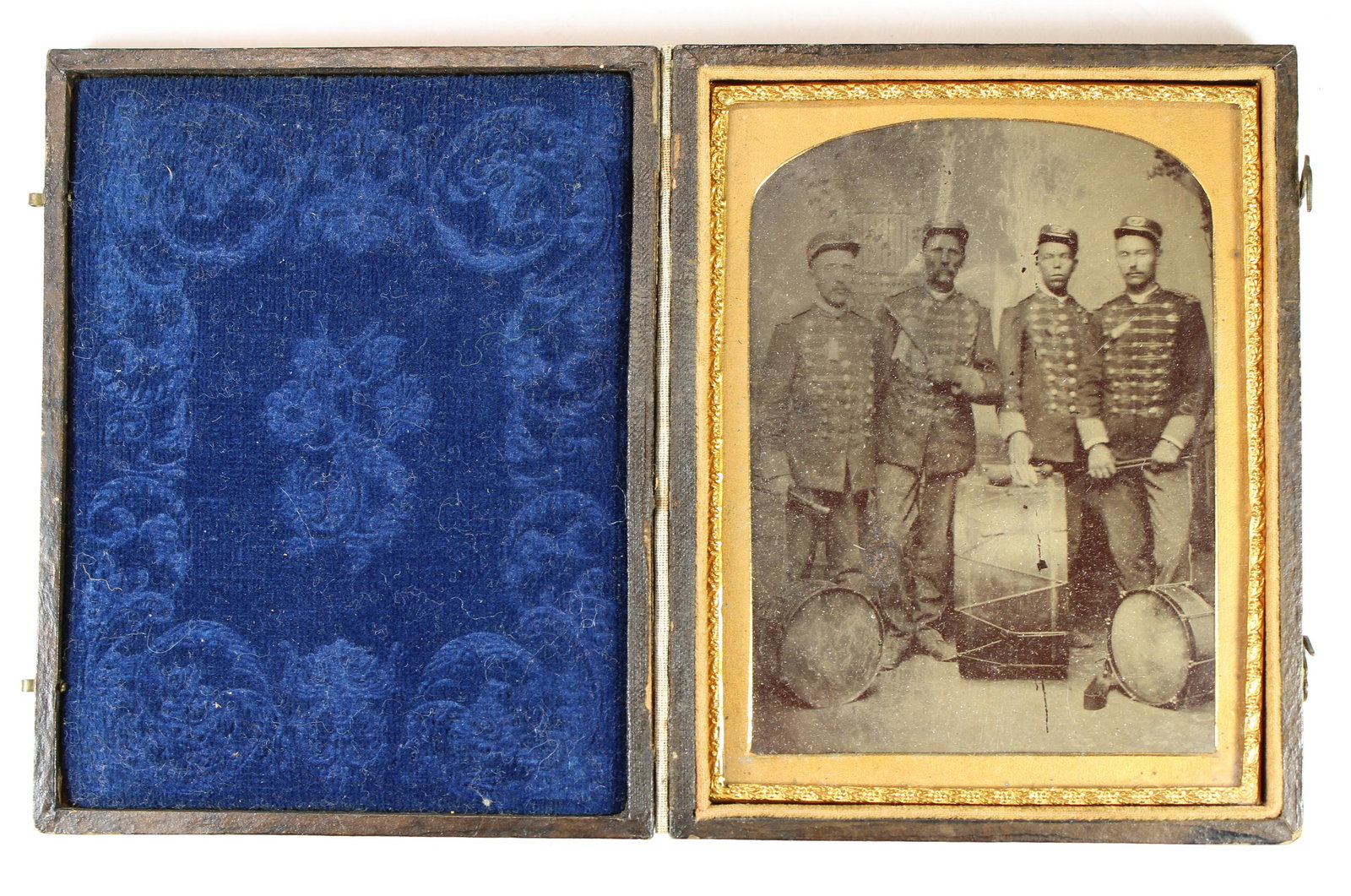 Indian War Era Soldiers w/ Drum: 1/4 plate tintype housed in a nice full leatherette case with blue velvet pillow. Interesting content. It has been suggested the subject second from the right may be African-American. Nearly 12,500 bl