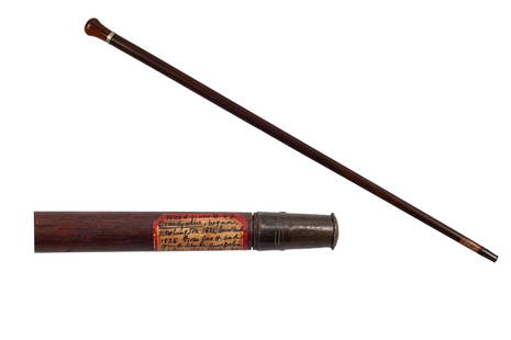 [Lafayette] Cane from USS Brandywine: ~33 inch wood cane with silver band affixed with an early 20th c. tag inscribed in ink: "Wood from USS Brandywine, begun, 1821, Washington, Ironclad(?), 1825. From Jas. H. and Wm. H. Sands, Annapolis,