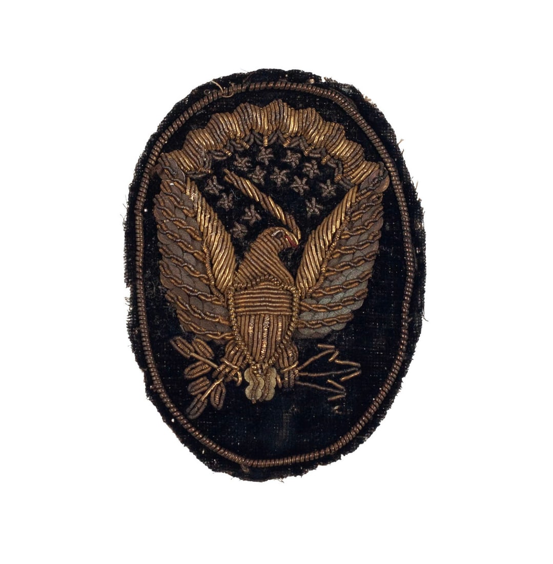 [CIVIL WAR] Officer's Hardee Hat Insignia: 1858 pattern officer's eagle Hardee hat insignia. Black velvet with gold and silver bullion embroidery enhanced with sequins and jaceron twisted wire. Eagle given black eye and red mouth. Buckram reve
