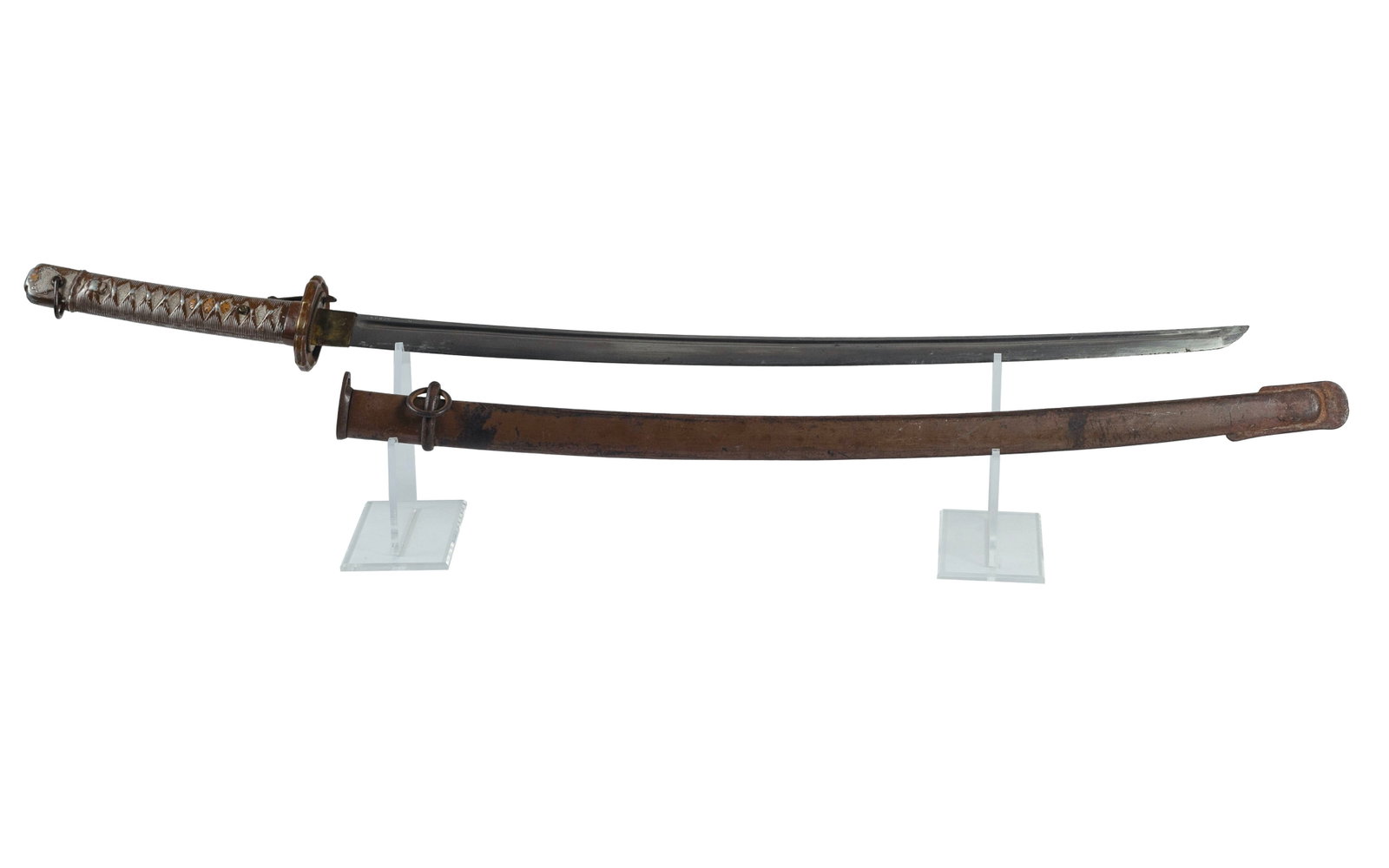 WWII Japanese NCO Shin-Gunto Sword: Machine made NCO shin-gunto sword and scabbard. [Japan], [before 1945]. Stamped serial number "140850" to blade and scabbard. A World War II-era Japanese non-commissioned officer's sword. With an all 