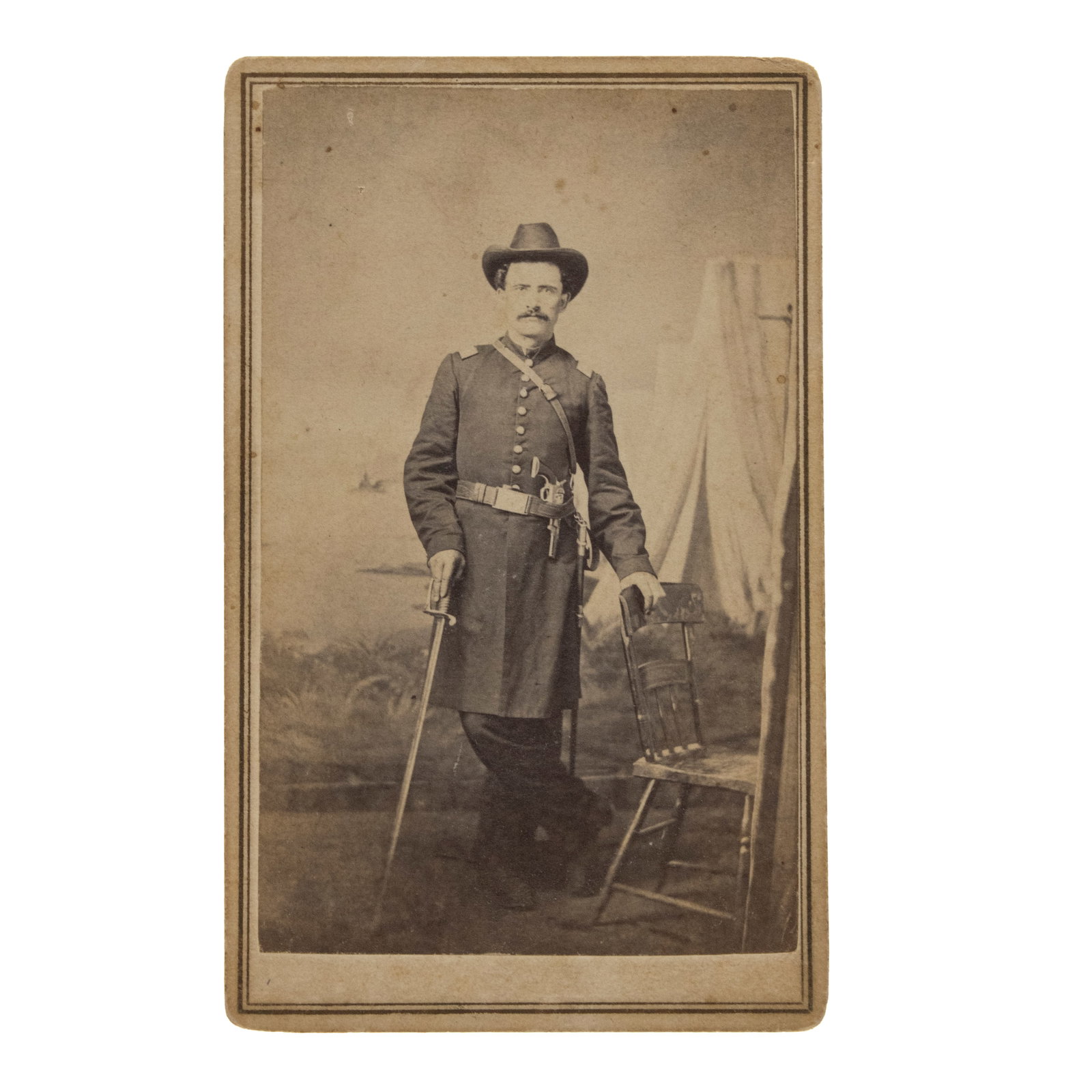 [CIVIL WAR] Double-Armed Defiance: Exceptional 1861 Union Officer CDV by Pioneer African American: This exceptional, historically significant CDV features a stellar example of early-war military portraiture paired with one of the most revered studio backmarks in the history of American photography.