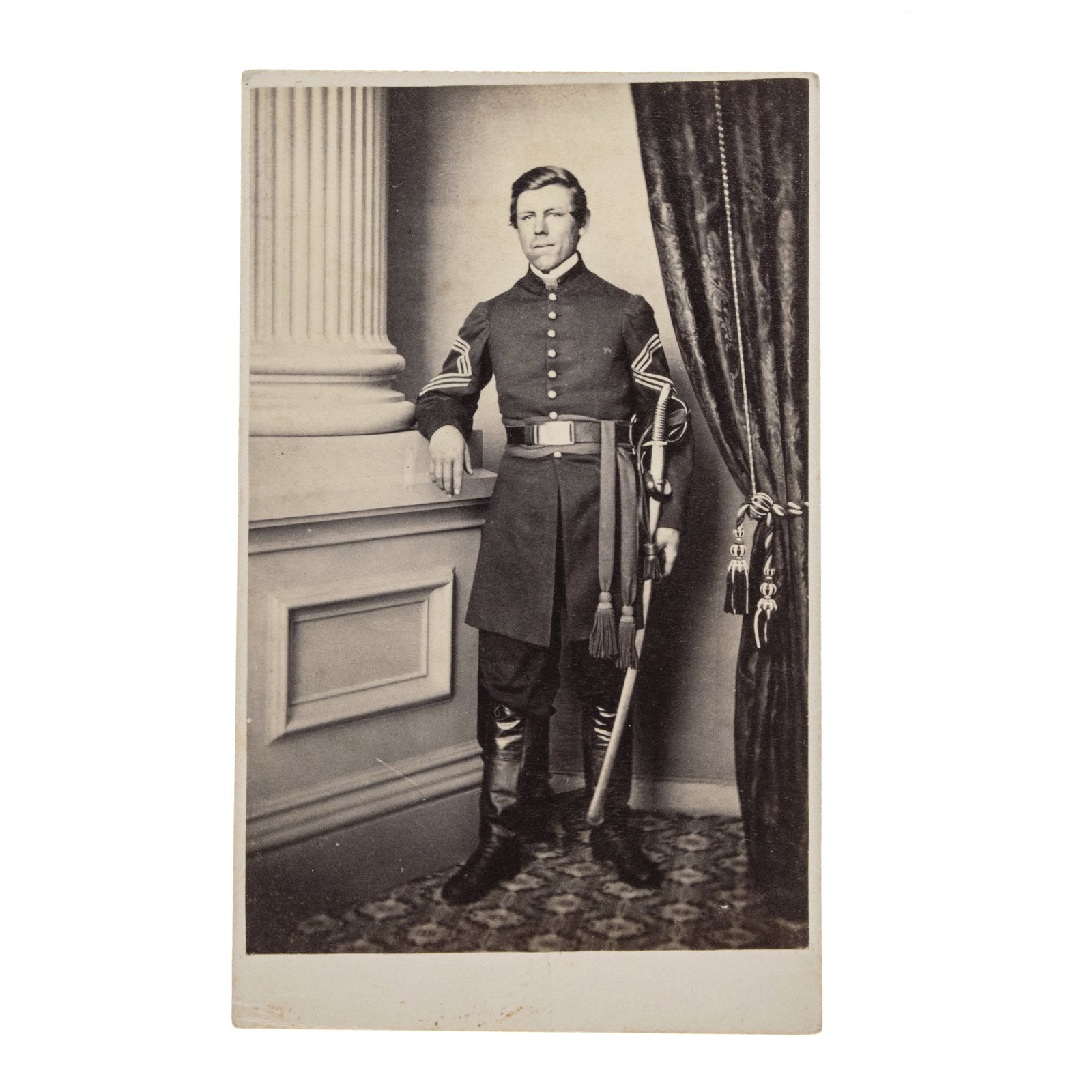 [GETTYSBURG] Medal of Honor Winner in Gettysburg: Sgt. Noble Preston, 10th New York Cavalry: Full-length studio portrait albumen CDV. Gettysburg, PA: Tyson Brothers, [circa 1861-1862]. Photographer's imprint to mount verso. Pencil inscriptions to mount verso read: "Nobel Preston / 10