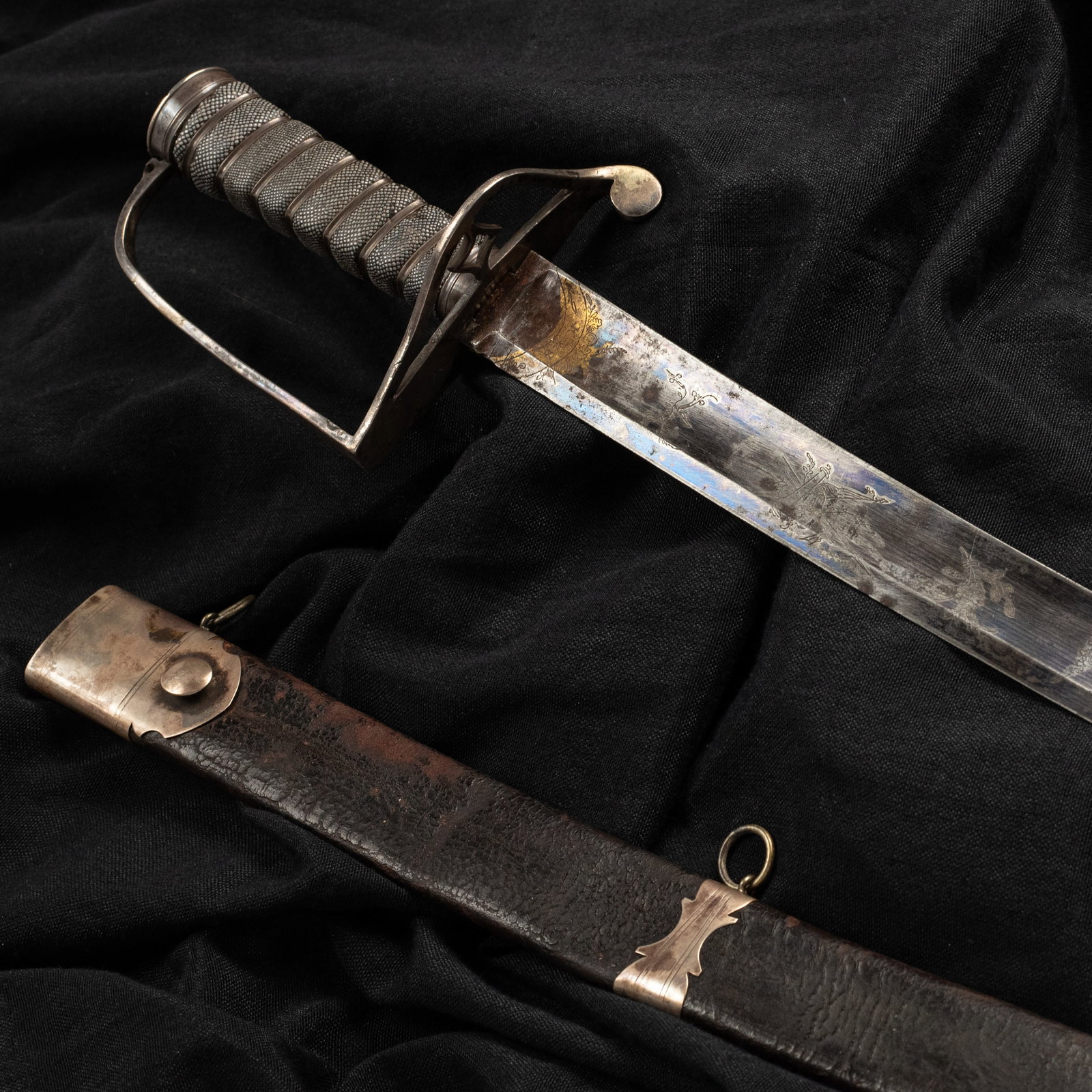 [War of 1812 / Napoleonic Wars] Silver Mounted Fire-Blued English Officers Sword by Francis Thurkle: 31.75" curved single edged blade with a 26" stopped median fuller and a 8.5" false edge. 1.2" wide blade at ricasso. 36.125" in overall length. 5" hilt silver hallmarked