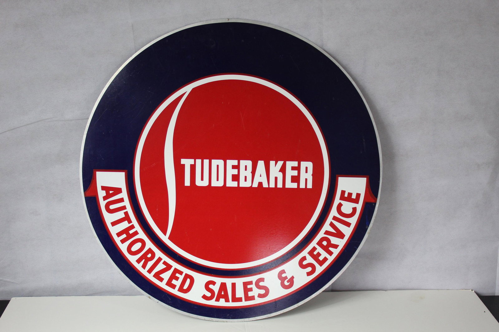 Studebaker Service Center Sign: Circular metal sign. Aproximately 24in. Probably a reproduction