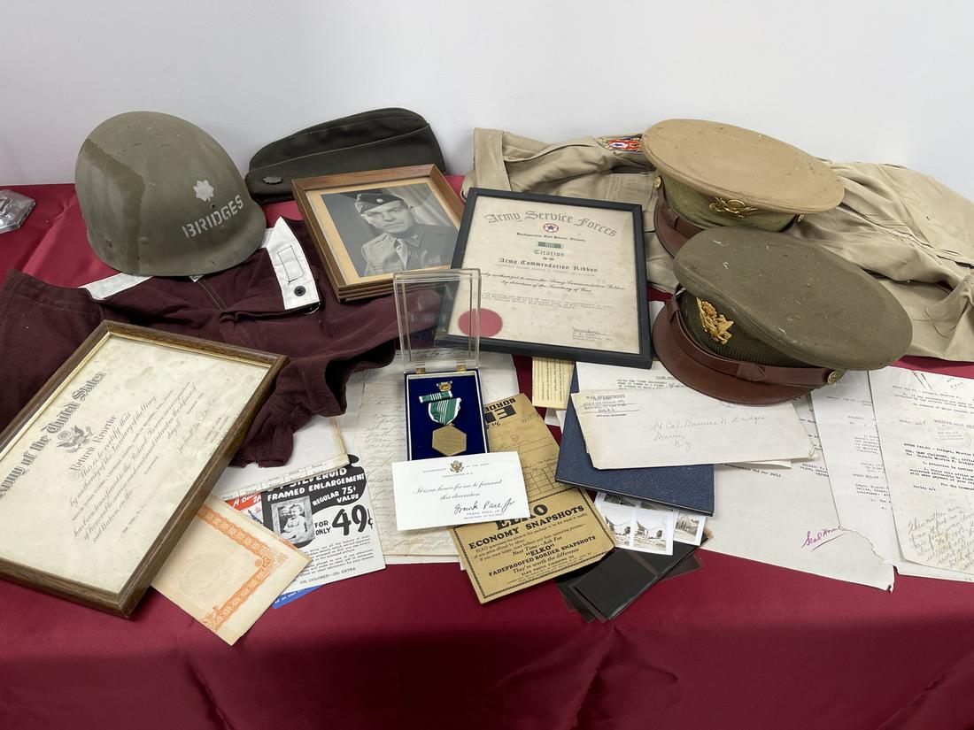 WWII Officer's Uniform and Medal Group: Contains all items shown. Col. Bridges served in Europe. Includes medals, documents, uniforms, helmet, photos and books as shown.
