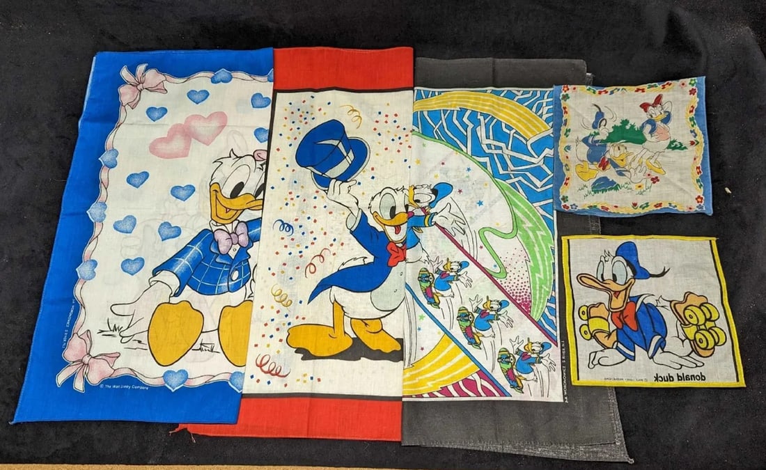 Five vintage Donald and Daisy Duck Handkerchiefs: Donald Duck In A Tux With Confetti handkerchief. This is approx 22x 22. Mini handkerchief of Donald and Daisy and measures approx. 8 x 8 Mini handkerchief of Donald on roller skates. this measures app