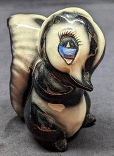 Disney Bambi Flower Figurine by Evan K. Shaw: Evan K Shaw Pottery Disney's Bambi Flower The Skunk Figurine. This is approx 4 x 2 1/2 x 4 3/8. The figurine has some crazing. From the 1940s