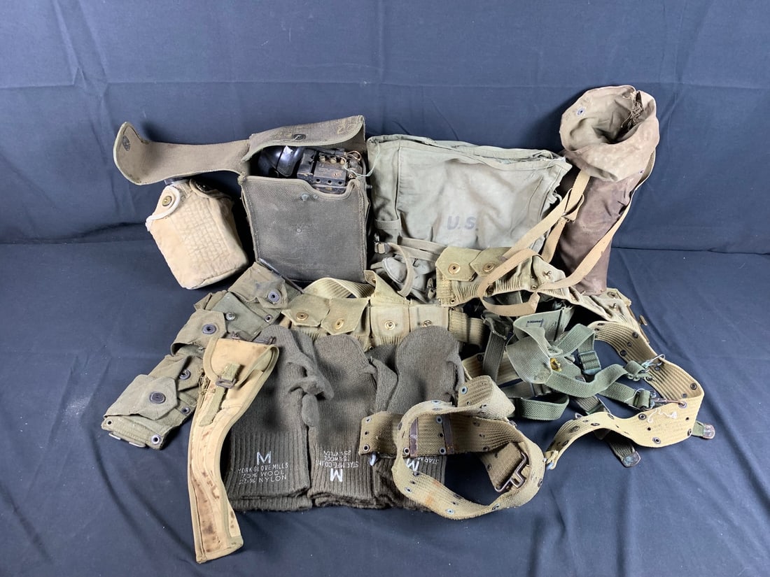 Mixed lot of military field gear: Includes NOS winter gloves. Field phone, canteen and pouch and more. Roughly 14 Pieces
