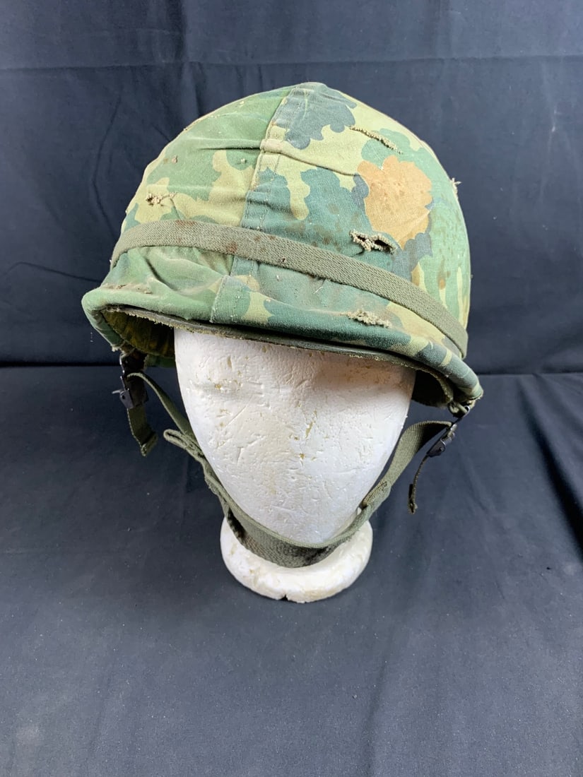 Vietnam War Camo Covered Airborne Helmet and Liner: Stains and holes may be present on liner.