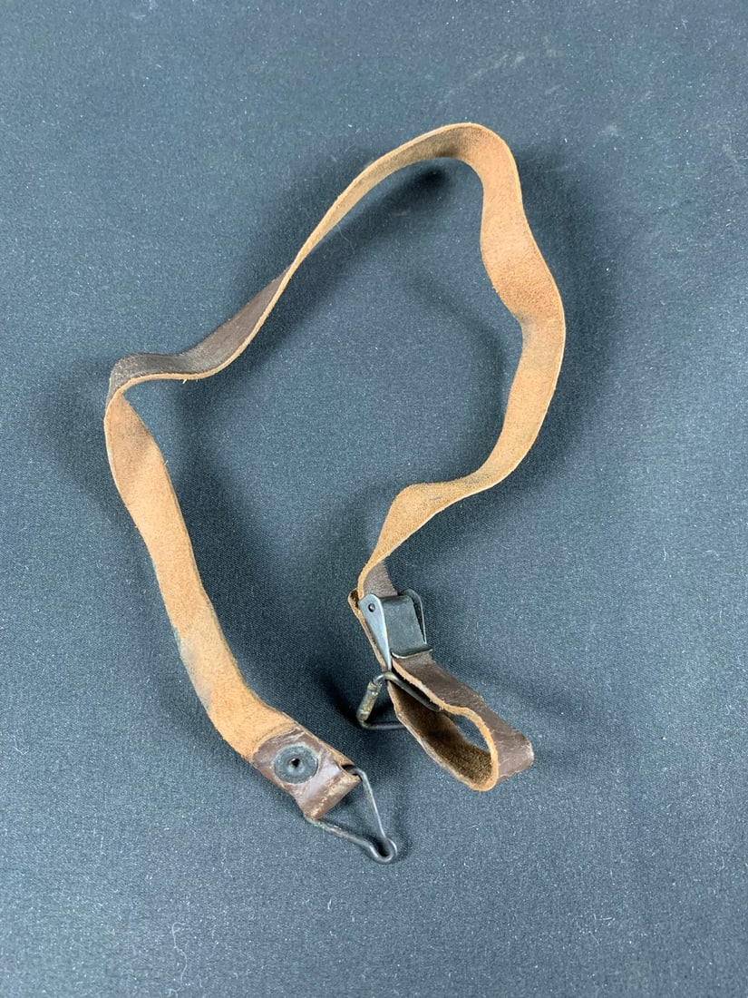 WW2 WWII United Carr M1 helmet leather chinstrap: Leather still pliable.Green helmet paint on part of strap