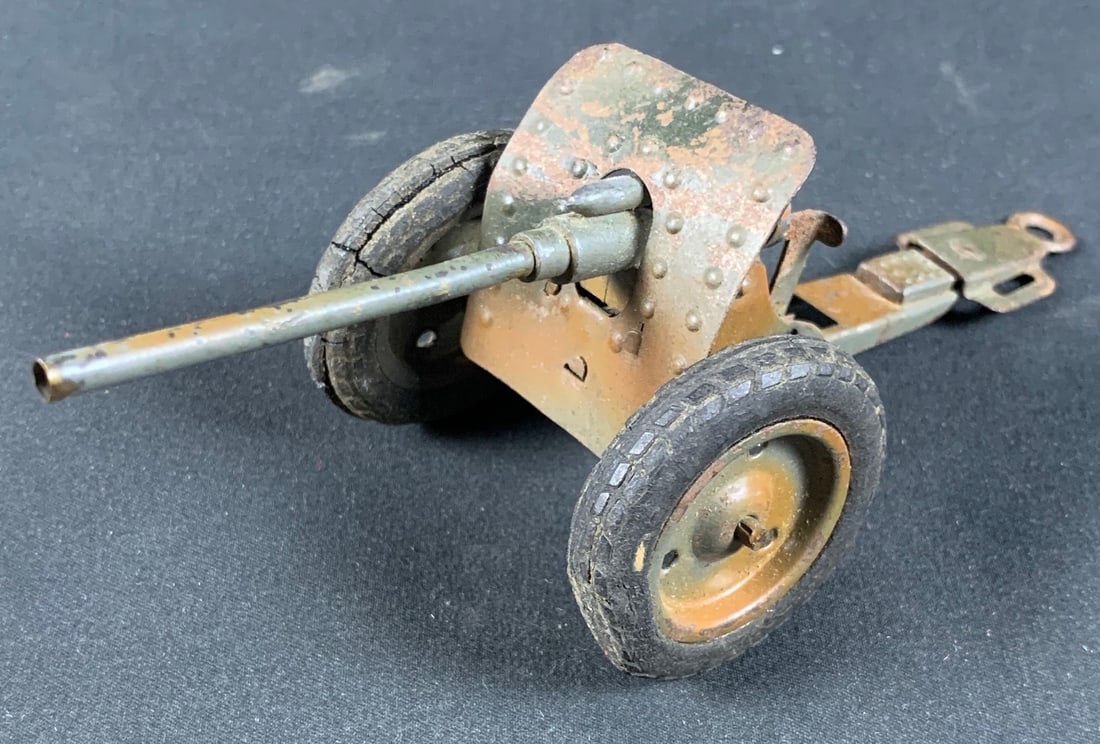 Vintage Tin German Anti Aircraft Cap Gun Toy: Little Rust and wheel sare cracked. But cap gun portion still locks and fires. Roughly 6"