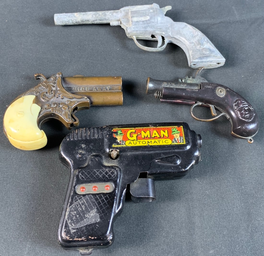 Mixed lot of vintage toy cap guns and sparking gun: Please note G-man Sparking toy is missing winding handle. Hideaway cap gun has a cracked handle. Lever action on all 3 cap guns are functioning
