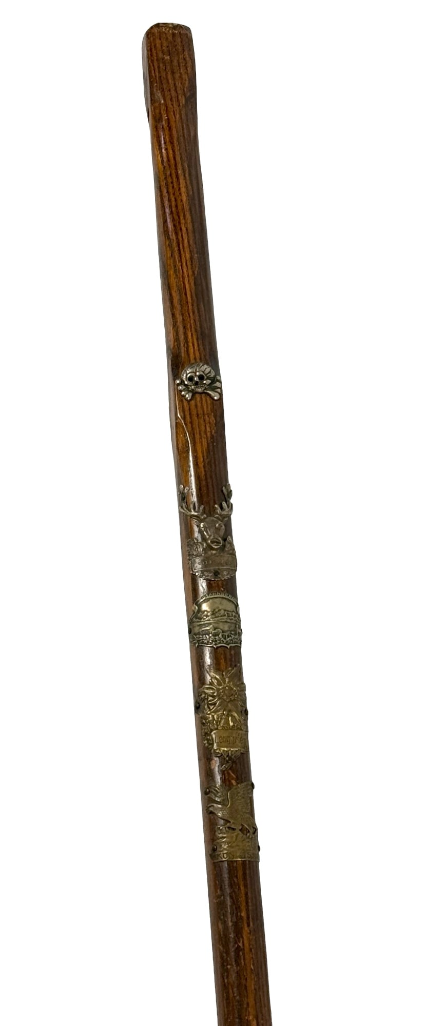 WWII Nazi Walking / Hunting Stick: 54in long and adormed with brass hunting badges and skull with cross bones. This was aquired by the 75th Div. Veteran who's personal items can be found in lot 128. SS is notched at the very top howeve