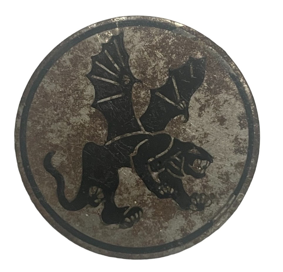 WWII DUI of the 541st Parachute Infantry Regiment: This piece is made by Eby with a pin back with simple C catch. The gilt finish on the front has flaked, but the design is still very clear. Originals like this one are made of steel and are magnetic.