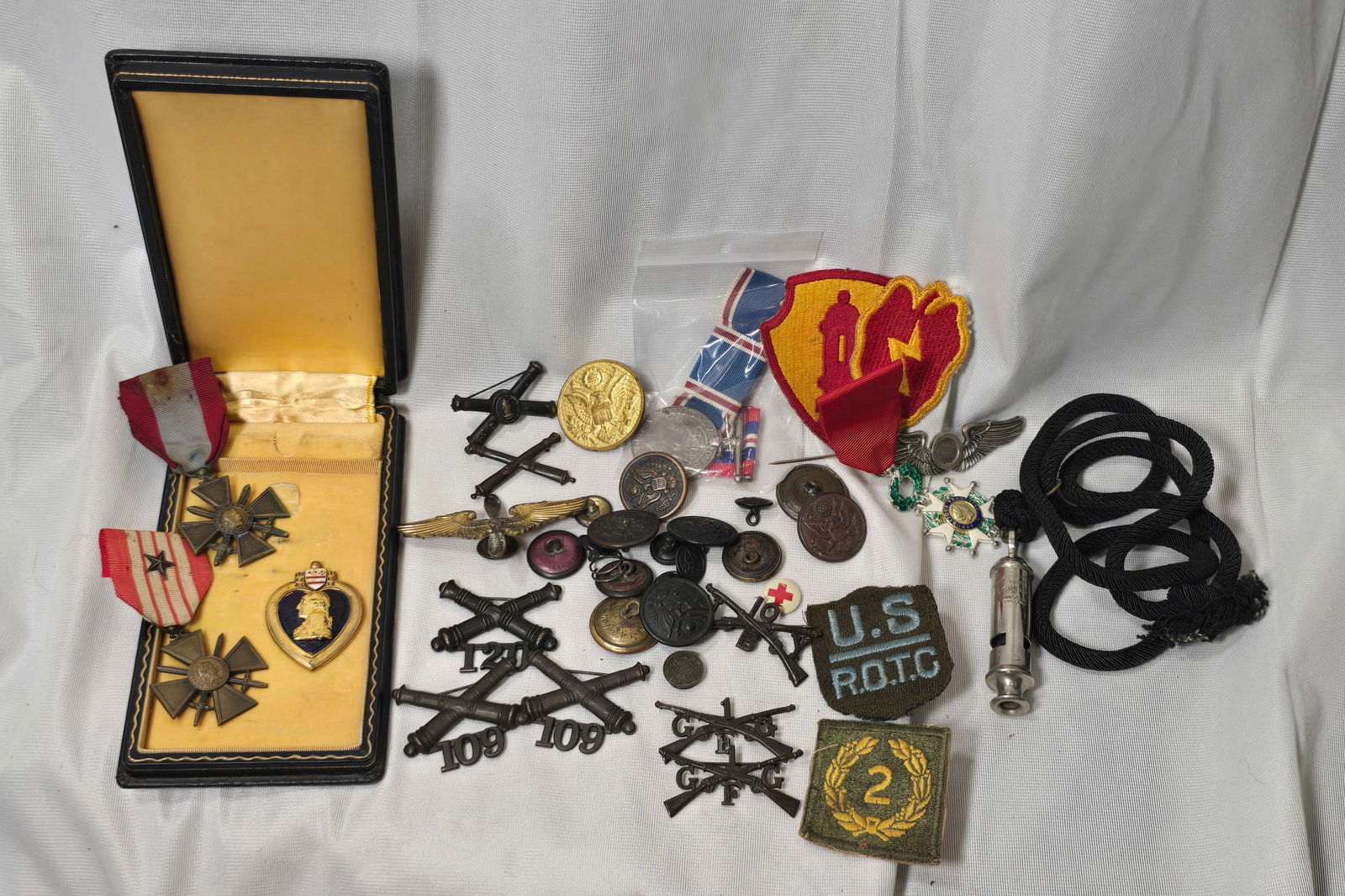 Misc WWI and WWII insignia, broken Purple heart with case, french medals, collar insignia, whisle, (1 of 6)