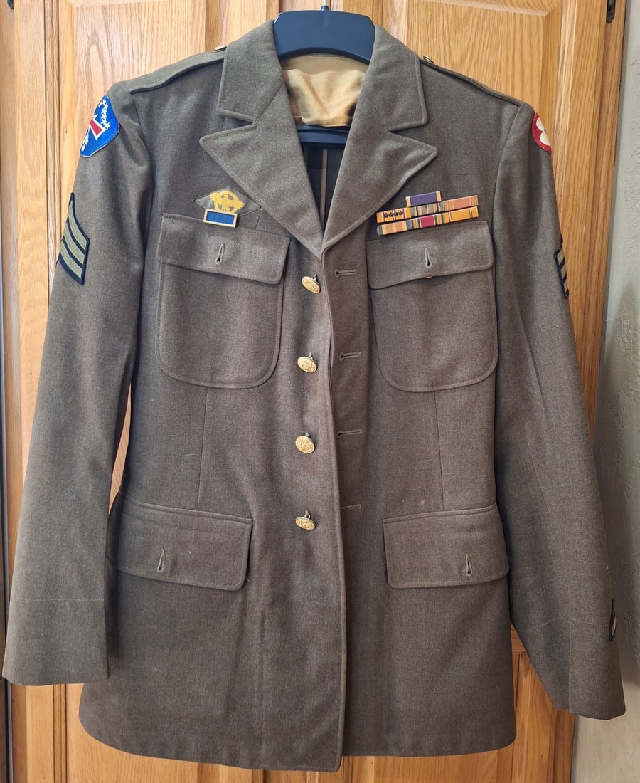 WWII EM Uniform - Pacific Theater: Unnamed WWII Uniform with the Following patches and ribbon bars attached. Patches: Pacific Theater, Army Service and ruptured duck. Ribbons: Purple Heart,