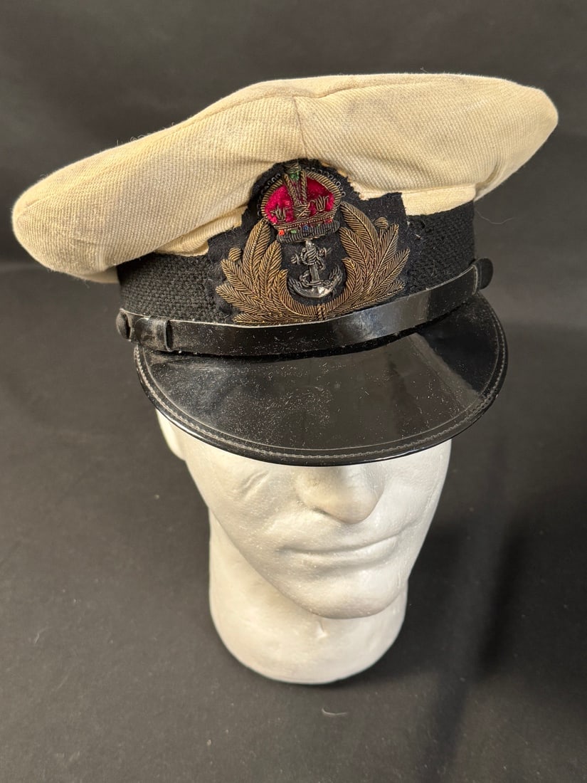 WWII Royal Navy Officer's Visor Cap: Complete with white dress cover. Bullion Officer's badge. In excellent condition
