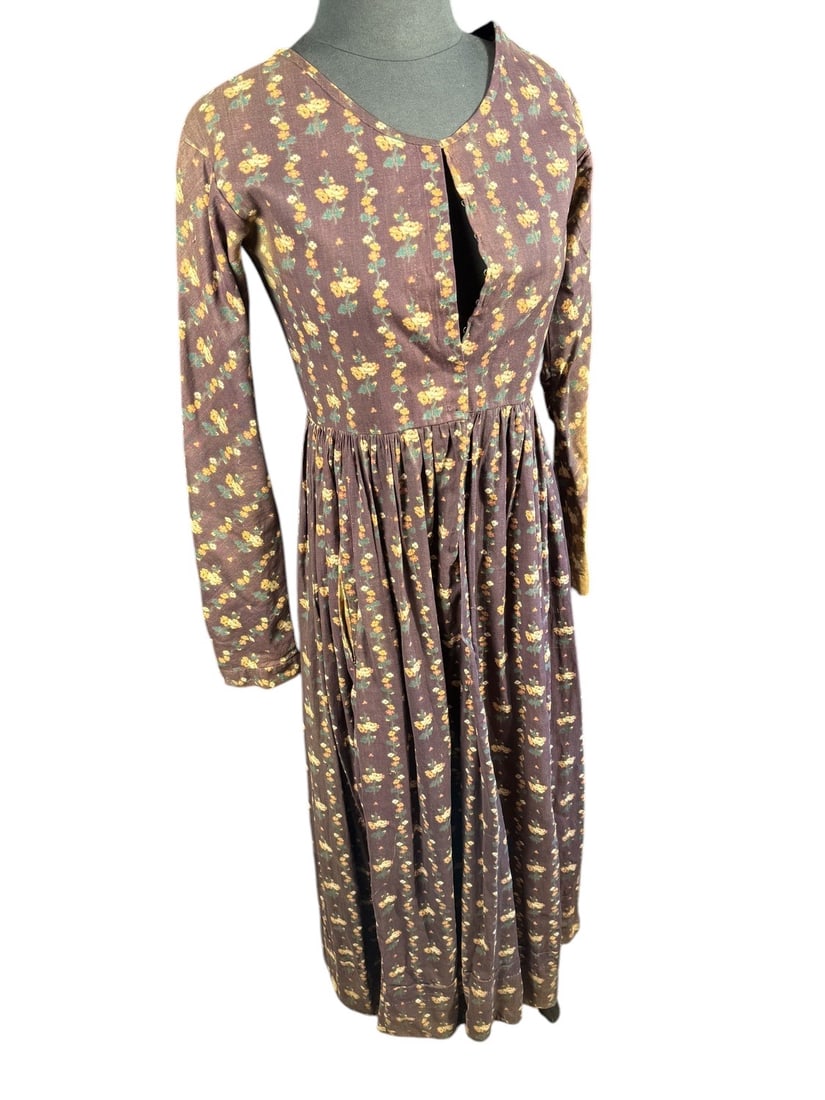 1860s Civil War Era Dark Eggplant Hand Printed House Dress: There is no evidence of machine sewing on this dress. It appears to be completely hand constructed in the common style of Civil War camp follower. The print is hand stamped and remarkably well done. H