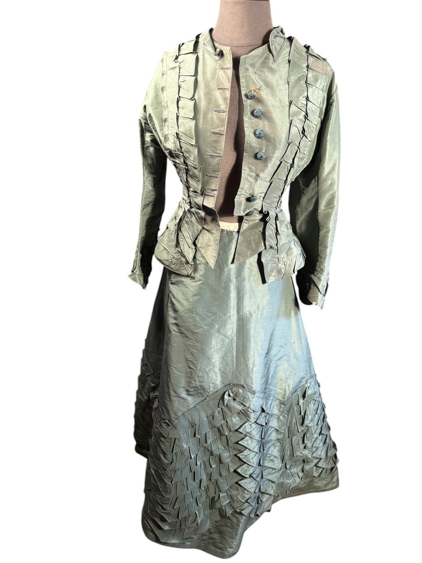 1960s Civil War Dark Sage Green Visiting/Day Dress with Hand Crochet Buttons: The smaller Pagoda sleeves on this taffeta day dress reflects the transitional styling between the late 1860s fullness and the early 1870s slimmer silhouette. The fiddle back construction mark it as l
