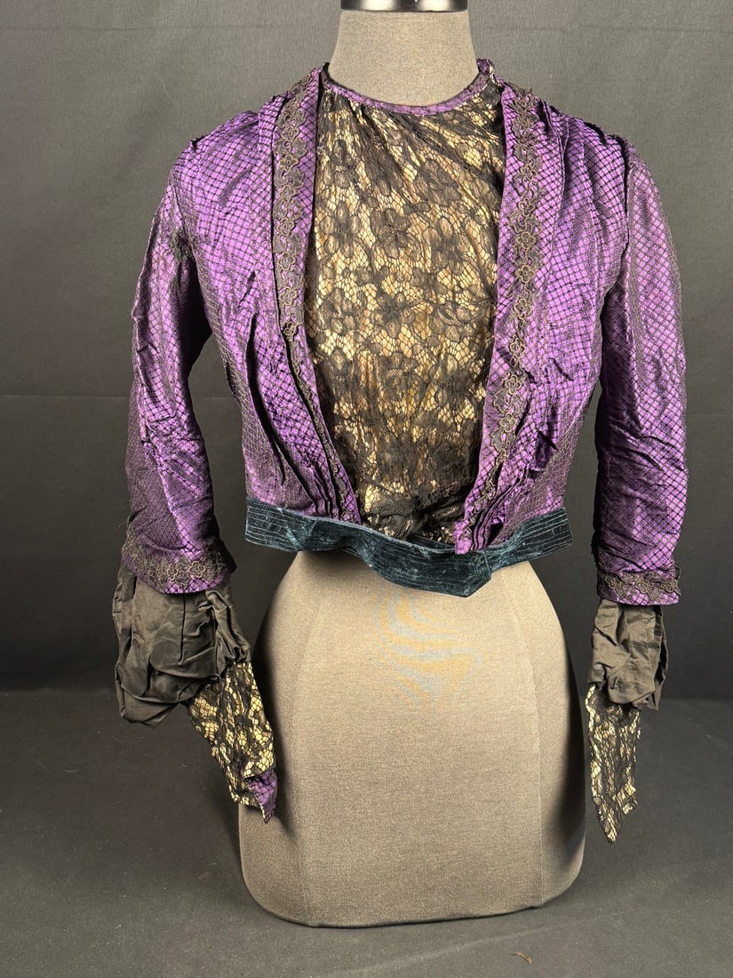 1870s Royal Purple Bodice with Pagoda Sleeves: The Pagoda sleeves and straight waistline on this bodice combined with the shaping of the lining and the front style reflect the transition in styles during the 1870s. A very unusual fabric choice of 