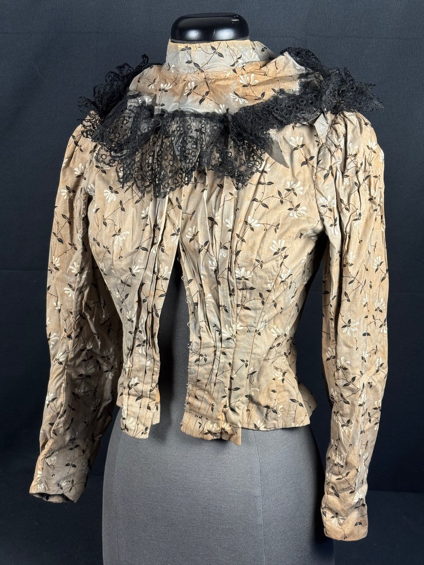 1870s Light Brown Bodice with False Collar: The most eyecatching part of this bodice is its false collar. The false collars allowed the wearer to change the look of a dress without changing the entier garment and it is rare for the false collar