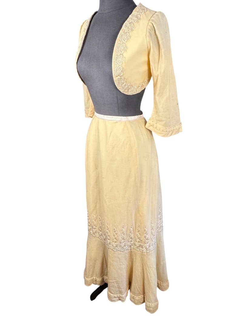 1905 Edwardian Yellow Wool Crepe Embroidered Bolero Gown: Absolutely stunning yellow embroidered crepe Bolero jacket and matching skirt. The machine embroidery detail around the front of the jacket and the neckline is extremely unusual in all but the most ex