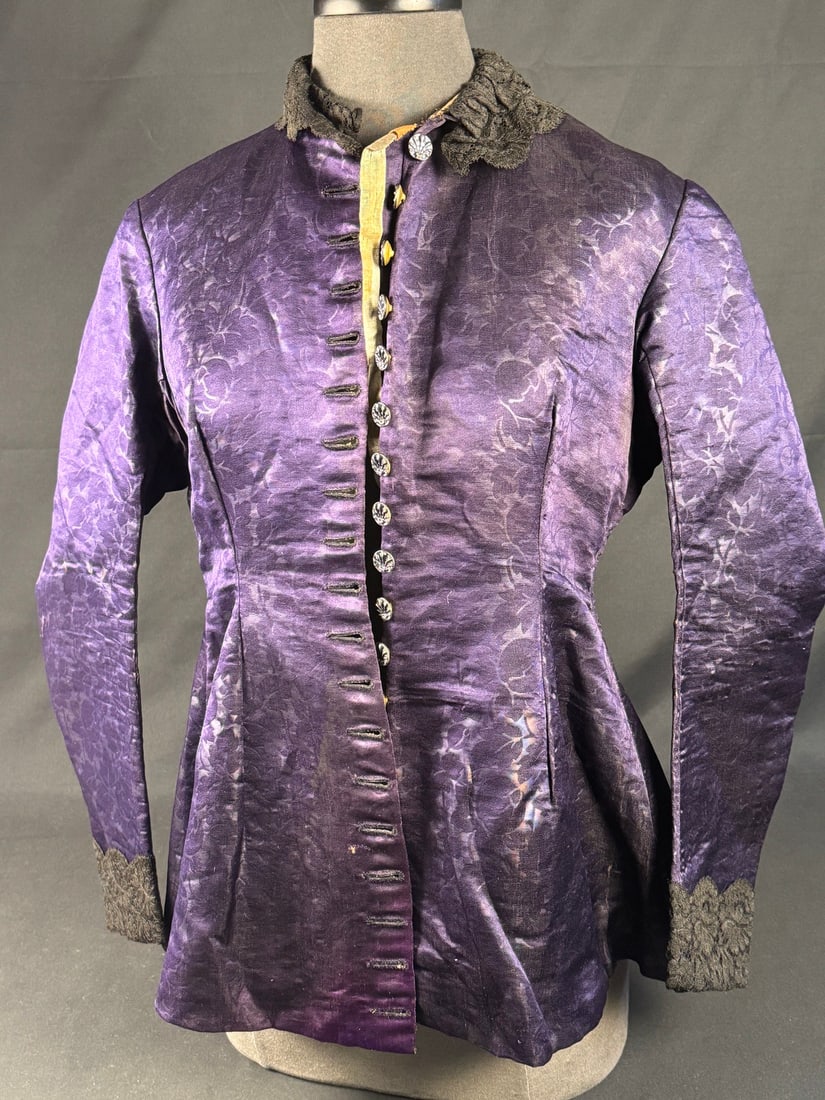 Late 1860s Purple Bodice: This bodice has an exceptionally large peplum attached and no boning leading to the conclusion it was designed during the transitional period between the large gowns and bell sleeves of the Civil War 