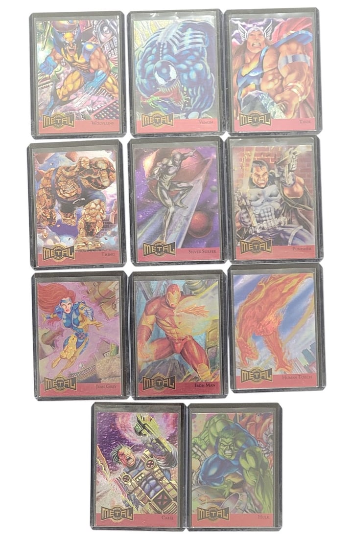 11-11-1995 Fleer Marvel Metal Inaugural Edition Limited Edition Metal Blaster Trading Cards: A group of eleven -11- 1995 Fleer Marvel Metal Inaugural Edition Limited Edition Metal Blaster trading cards. Each card is individually enclosed in a clear plastic protective sleeve. The cards feature