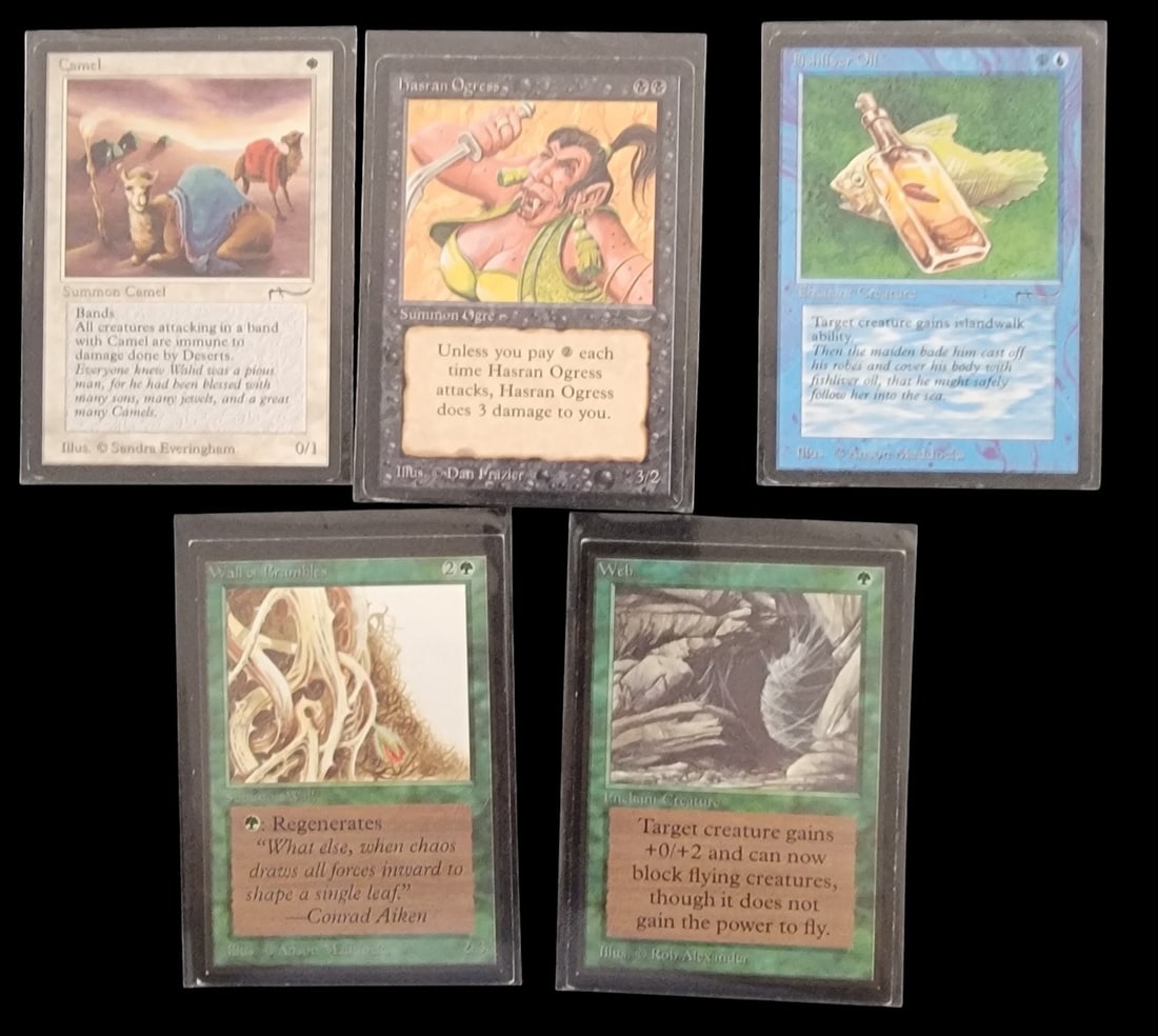 5 Magic: the Gathering Trading Cards, Arabian Nights and International Edition: A group of five Magic: The Gathering trading cards. The lot includes three cards from the highly sought-after Arabian Nights expansion: -Hasran Ogress- -illustrated by Dan Frazer-, -Camel- -illustrate