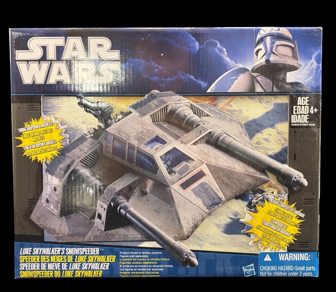 Star Wars Clone Wars Luke Skywalker-s Snowspeeder Vehicle by Hasbro, 2009: A Star Wars Clone Wars Luke Skywalker-s Snowspeeder vehicle, produced by Hasbro in 2009. The item is presented new and sealed in its original cardboard box with a clear plastic window. The packaging f
