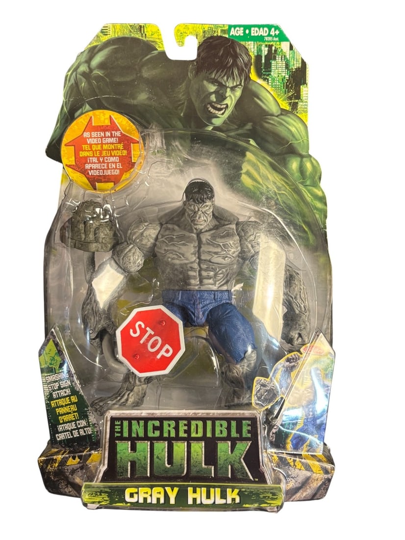 Hasbro the Incredible Hulk Gray Hulk-smashing Stop Sign Attack-Action Figure, 2008: A Hasbro -The Incredible Hulk- Gray Hulk action figure from 2008, featuring the -Smashing Stop Sign Attack- accessory. The figure is sealed in its original clear plastic blister packaging with a multi