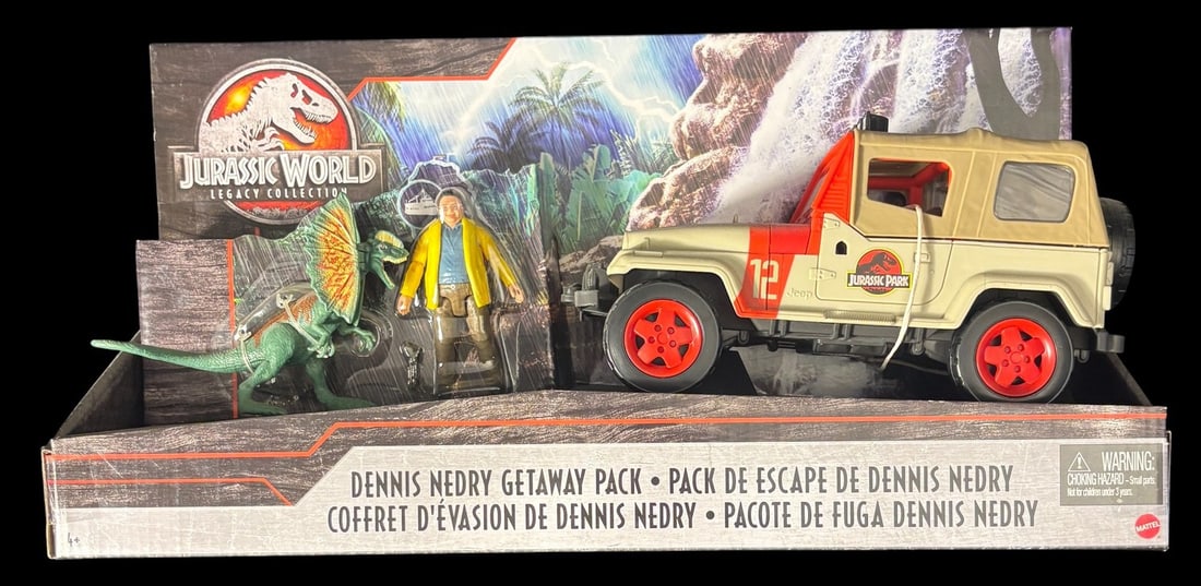 Mattel Jurassic World Legacy Collection Dennis Nedry Getaway Pack: A Mattel Jurassic World Legacy Collection -Dennis Nedry Getaway Pack-. This plastic toy set is presented new in its original manufacturer-s cardboard and blister packaging. The set comprises a cream-c