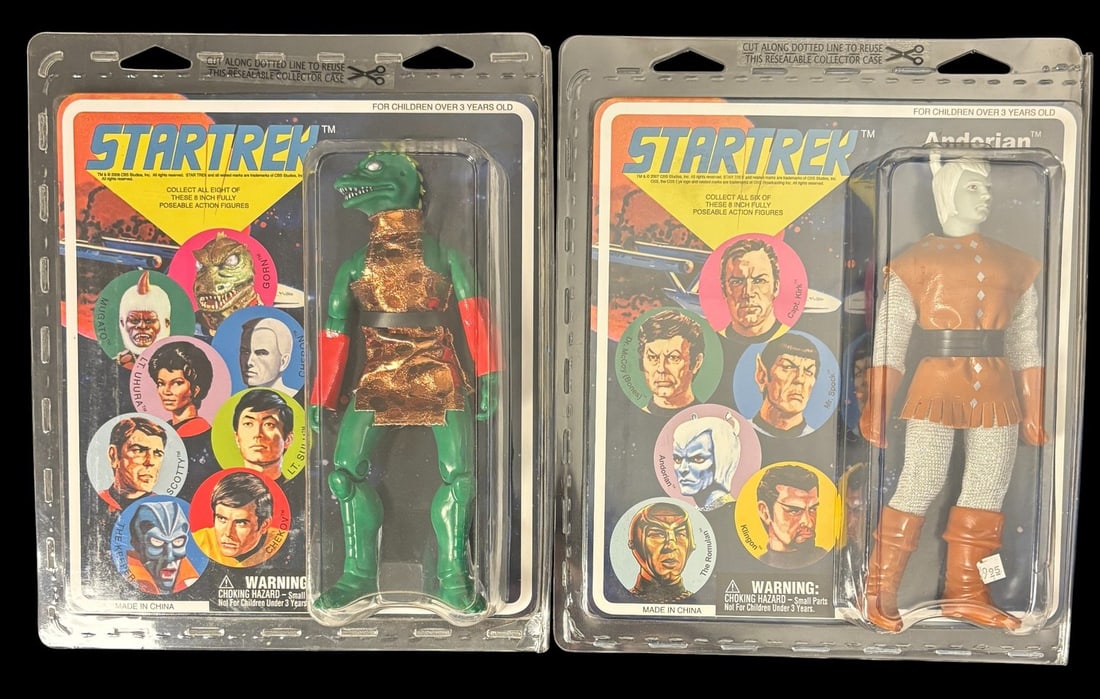 A Pair of Star Trek Mego-style 8-inch Action Figures by Emce/diamond Select, 2008, Featuring Gorn: A pair of Star Trek Mego-style 8-inch action figures by EMCE/Diamond Select, dating from 2008, presented in their unopened, retro-style clear plastic clamshell packaging with cardboard backings. The l