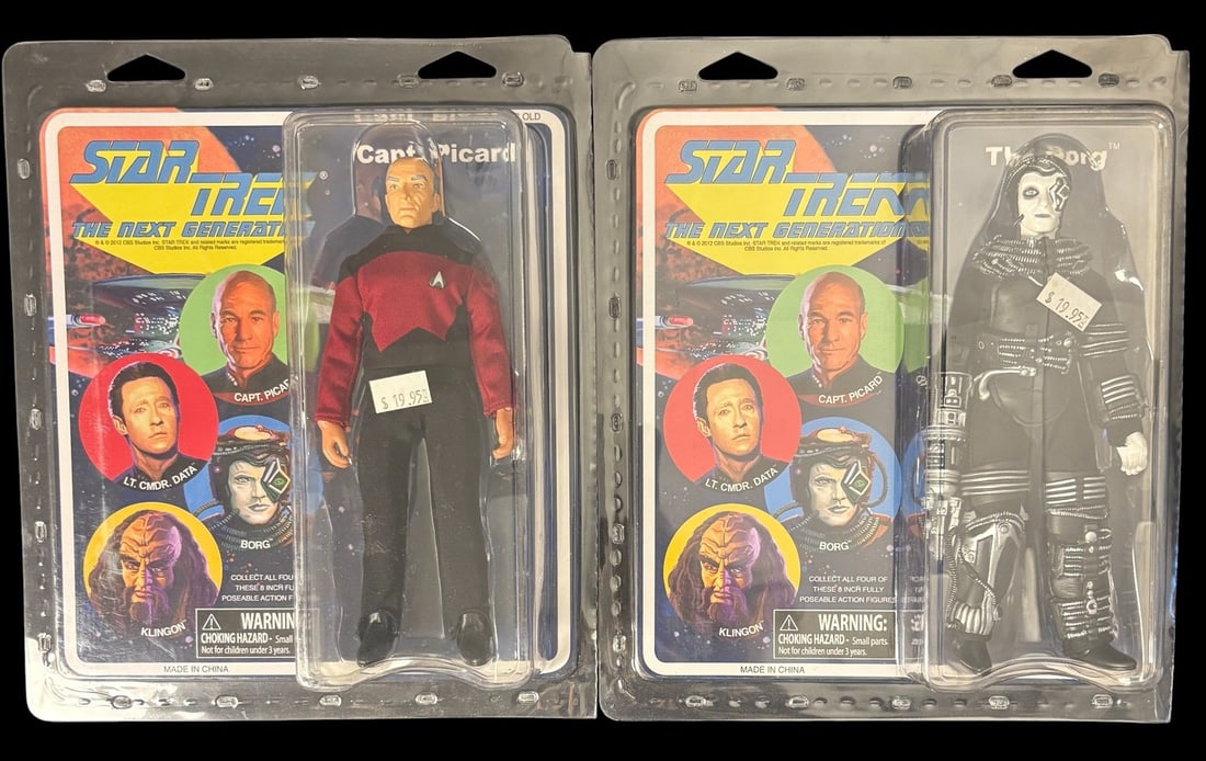 A Pair of Diamond Select Toys Star Trek: the Next Generation 8-inch Retro Cloth Action Figures,: A pair of Diamond Select Toys Star Trek: The Next Generation 8-inch Retro Cloth Action Figures, depicting Captain Jean-Luc Picard in a red Starfleet uniform and a Borg Drone. Both figures are construc