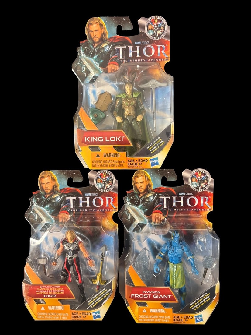 3 Hasbro Marvel Studios Thor the Mighty Avenger Action Figures, 2011, Comprising King Loki, Battle: A group of three Hasbro Marvel Studios Thor The Mighty Avenger action figures, dating from 2011. Each figure is presented new in its original, sealed blister card packaging. The lot includes -KING LOK