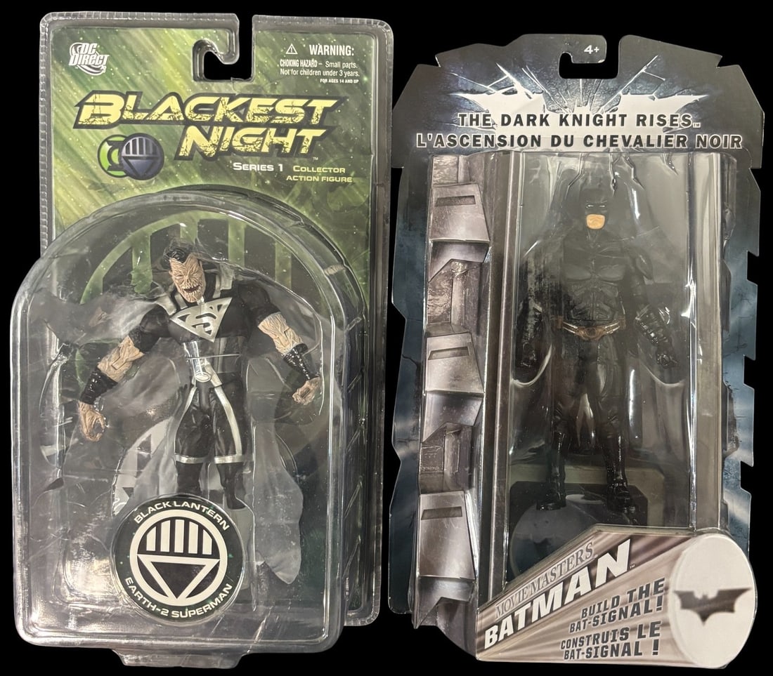 A Pair of Dc Direct Blackest Night Series 1 Black Lantern Earth-2 Superman and the Dark Knight Rises: A pair of plastic action figures, each new in their original, unopened blister packaging with cardboard backings. The first figure, from DC Direct-s -Blackest Night Series 1 Collector Action Figure- l