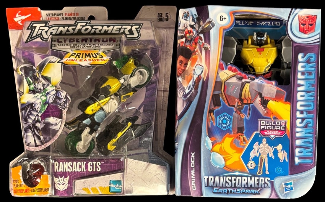 A Pair of Transformers Action Figures: Cybertron Primus Unleashed Scout Class Ransack Gts and: This lot features two distinct, new-in-package Transformers action figures. The first is a Transformers Cybertron Primus Unleashed Scout Class Ransack GTS figure, depicting a yellow, green, and black