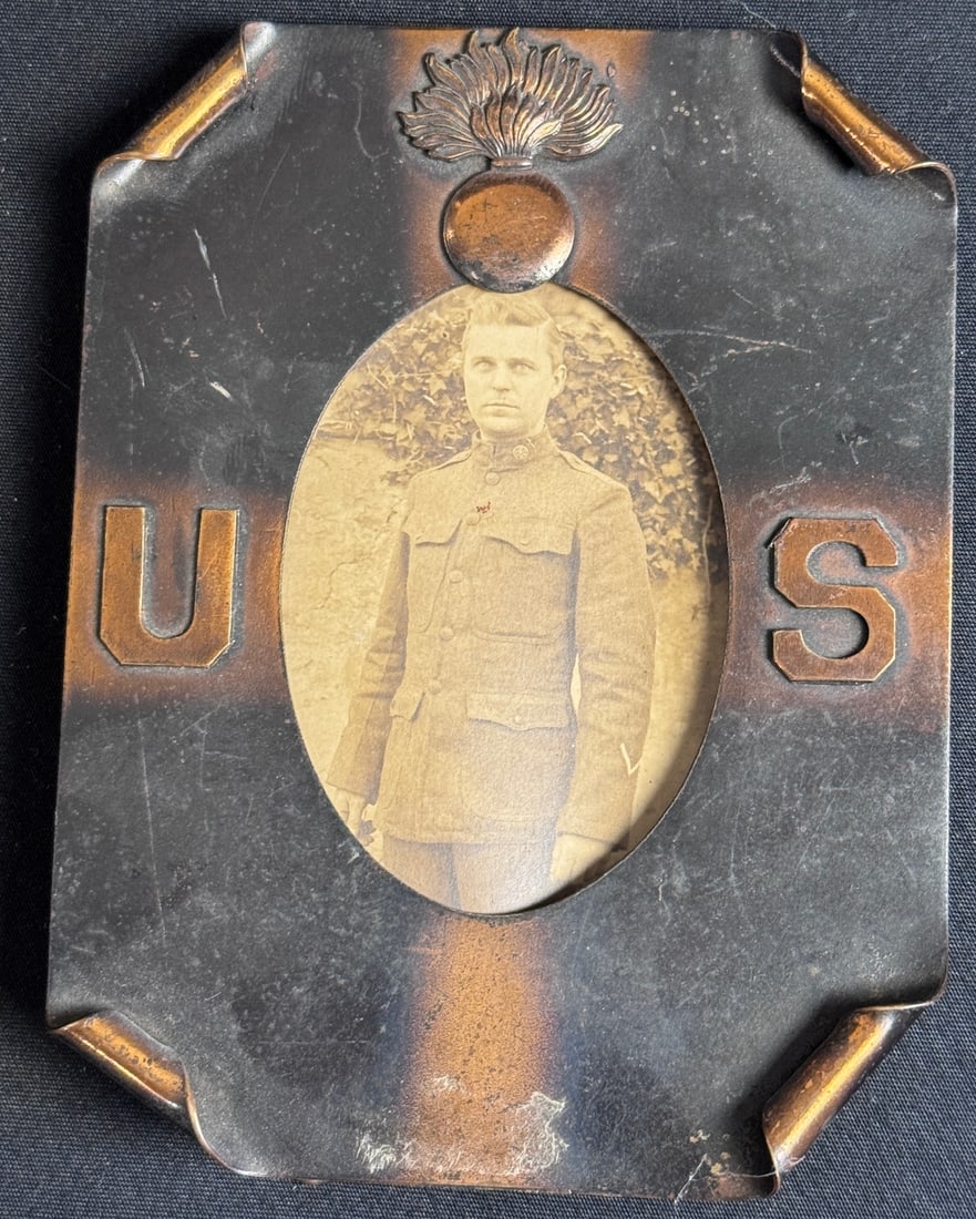 Rare WWI Era Copper and Metal Photo Frame with Artillery Soldier Portrait: This is a rare and highly evocative World War I-era cased photograph presented in a distinctive metal frame, likely dating from the 1917?1919 period. The outer frame is constructed of patinated or che