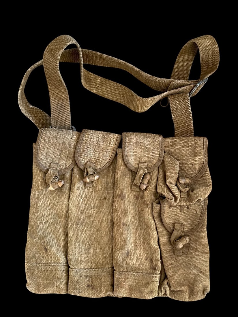 Rare WWII Imperial Japanese Army Canvas Ammunition Bandolier with Markings: This is a rare and authentic World War II era Imperial Japanese Army ammunition bandolier or magazine pouch vest. The piece is constructed of sturdy, coarse khaki canvas material and is designed with 